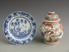 A 19thC Japanese Imari covered vase with relief moulded dragon decoration and a 19thC Chinese export