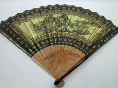 Two Japanese fans, one with calligraphy and rising sun decoration, the other with lacquer guards