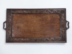 19th/20thC Chinese carved twin handled tray decorated with dragons and symbols, W83 x D44cm