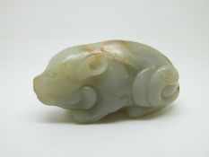A 19thC Chinese carved jade figure of a recumbent pig, height 4cm x length 7.5cm