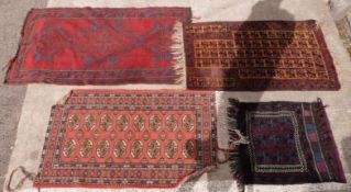 Three woollen rugs including a Turkoman example on brown ground and a camel rug, largest 170x95