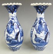 A pair of 19thC Japanese blue and white flared vases, H 24cm