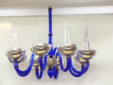 A very large Murano style glass chandelier with colbalt blue shaft and arms decorated with