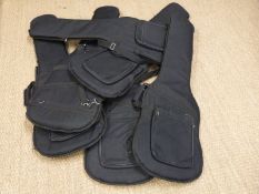 Six padded soft guitar carry cases.