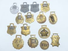 Fifteen various horse brasses to include MR Co. (possibly Midland Railway), LCC, BYB Ltd, RSPCA