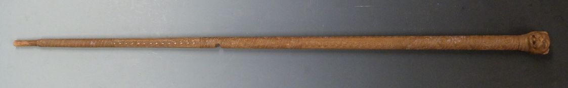 An antique Burmese cane, the intricately carved shaft with lion head knop handle, L100cm