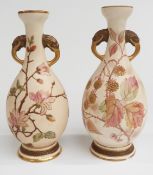Wedgwood pair of pedestal vases with twin figural elephant handles, decorated with flowers and