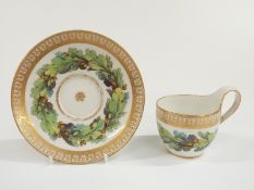 Berlin porcelain cabinet cup and saucer decorated with oak leaves and acorns and a gilded border,
