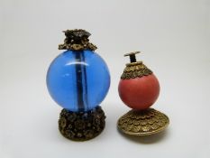 Two Chinese mandarin hat finials, one in blue glass the other coral coloured, height 5.5cm
