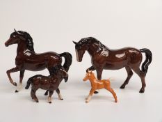 Beswick stocky jogging mare, prancing Arab, Shetland foal and palomino foal standing square, tallest