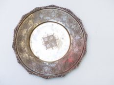 Iranian or similar Middle Eastern white metal dish with engraved decoration and raised foliate edge,