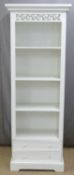 White painted bookcase with pierced and carved decoration, the base fitted two drawers, W66 x D40