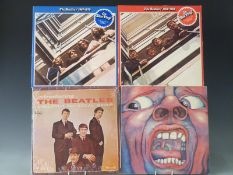 Approximately 40 records including The Beatles and some Reggae