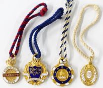 Four late Victorian / early 20thC Sandown horse racing enamel badges, each with member's number to