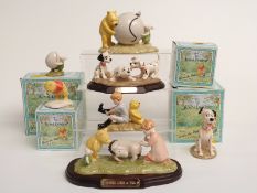 Royal Doulton Winnie the Pooh figures and two 101 Dalmatians figures