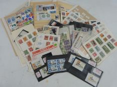 A large quantity of mainly Commonwealth stamps, all region, loose, on stockcards and in stamp