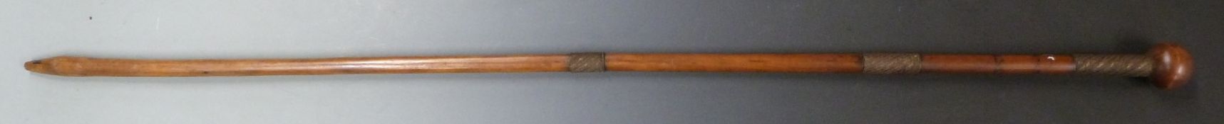 A 19thC African tribal knobkerrie staff with three braided wire grips, L134cm
