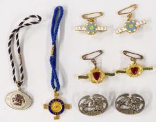 Eight 1920s Sandown horse racing enamel badges, each with member's number to rear, comprising