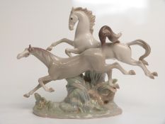 Lladro figure of two galloping horses, H 30cm, L 39cm