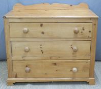 Pine chest of three drawers with turned bun handles, W105.5 x D48.5 x H94.5cm