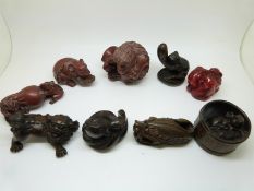 Eight wooden Japanese netsukes, all signed