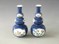 A pair of 19th/20thC Japanese triple gourd vases decorated with insects and flowers with Artemis