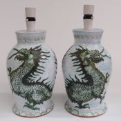 A pair of Isle of Wight pottery lamps decorated with dragons, H37cm