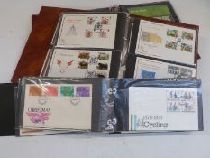 An album of GB presentation packs and two albums of first day covers