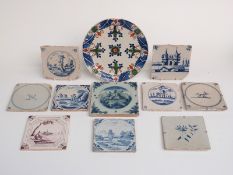 Ten 18th century Delft tiles and a Delft charger/plate