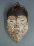 A 19thC / 20thC African tribal mask, height 28cm