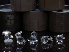 Five Swarovski cut glass animals comprising seal, rabbit, fish, pig and mushrooms