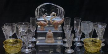 Sixteen 18thC and later clear glass drinking glasses together with a pair of amber glass bowls and