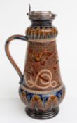 Doulton Lambeth pedestal ewer with floral decoration, hallmarked silver mount and hinged lid with