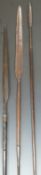 Three 19thC African double ended spears with carved geometric decoration, copper ferrules etc, one