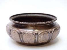 Iranian or similar Middle Eastern white metal bowl with engraved panelled decoration and raised