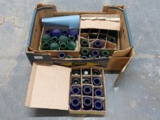 Approximately 42 green and blue glass candle holders