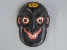 A 19thC / 20thC African tribal mask, height 18cm