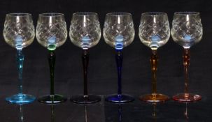 A set of six glass drinking glasses cut bowls and coloured stems and feet, 19.5cm tall
