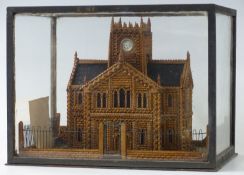Victorian scratch built carved wooden church surrounded by railings, in glass case, Weston