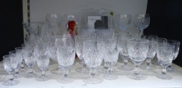 Thirty-eight Waterford and similar cut glass drinking glasses together with a Murano dog and a