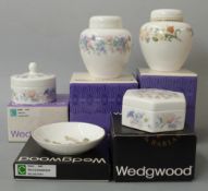 Collection of boxed Wedgwood ceramics including trinket boxes, covered vases etc
