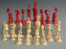A 19thC Chinese export ivory 'Burmese' pattern part chess set. Stained red and natural, the kings