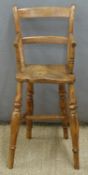 19thC or early 20thC child's highchair with elm seat, height 83cm