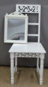 White painted chair with pierced and carved decoration and a similar mirror