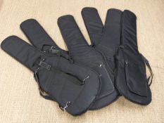 Six padded soft guitar carry cases.