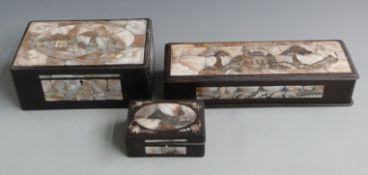 Three Japanese boxes set with mother of pearl scenes, largest 30 x 11cm