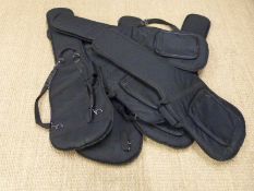 Six padded soft guitar carry cases.