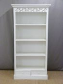 White painted bookcase with pieced and carved decoration the base fitted two drawers, W89 x D39 x