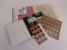 A stockbook of GB mint QEII stamps. Many large blocks including 1953 Coronation, cylinder numbers,