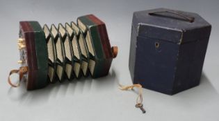 Lachenal and Co Anglo concertina c1910, with rosewood fret worked ends, 21 bone buttons, steel